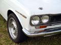 close up of datsun 1600 headlights