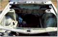 the engine bay after stripping the hard way with paint stripper and sandpaper...