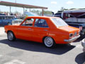 orange datsun 1200 sedan