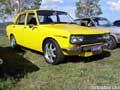 yellow datsun 160